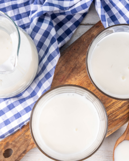 glasses of buttermilk on a blue- and white-checked cloths. - I Don't Have Buttermilk! The Food Substitutions Bible