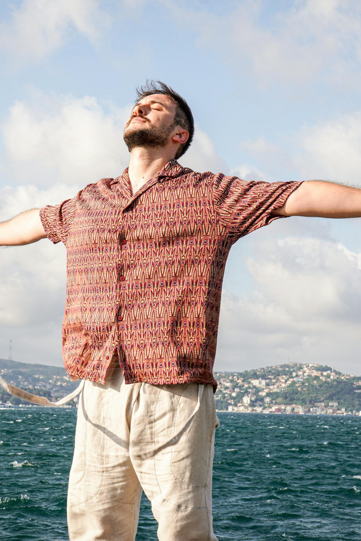 Man feeling pain relief by the ocean - You're Unique and So is Your Pain | Robert Rose Books
